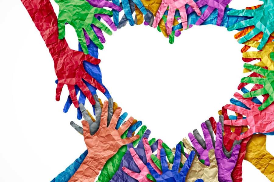 Colorful paper hands in a heart shape | Bentley Systems | Infrastructure Engineering Software Company Colorful paper hands in a heart shape