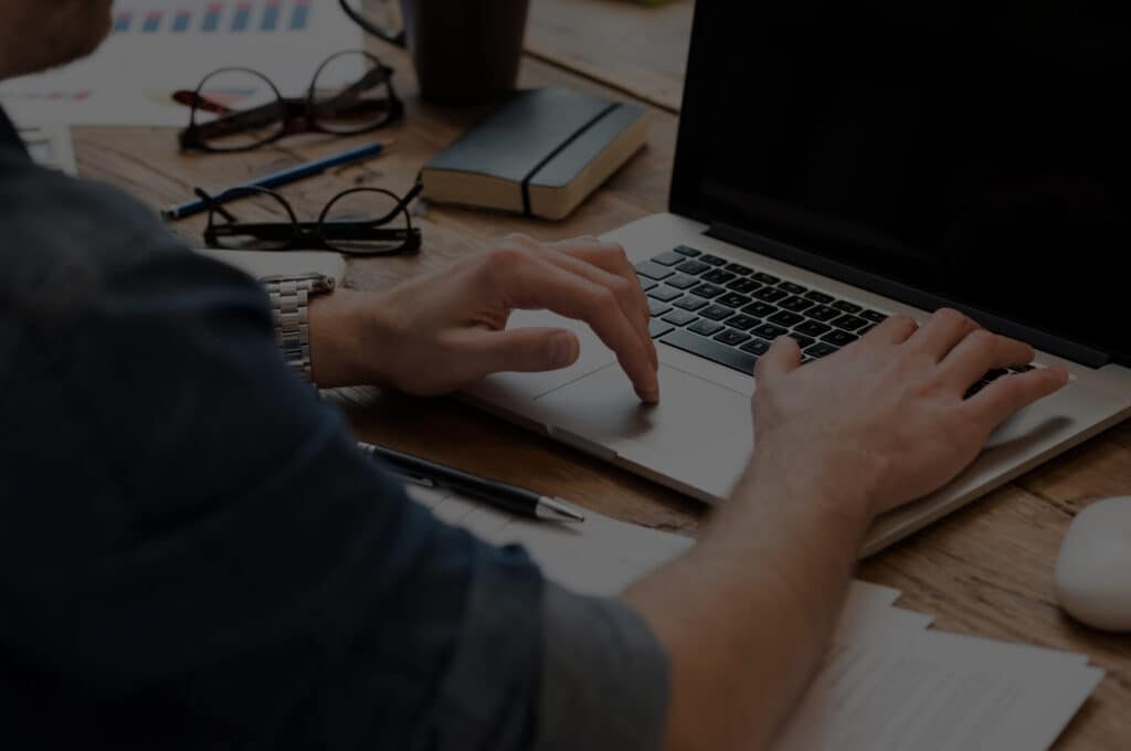 A man is typing with keyboard | Bentley Systems | Infrastructure Engineering Software Company A man is typing with keyboard