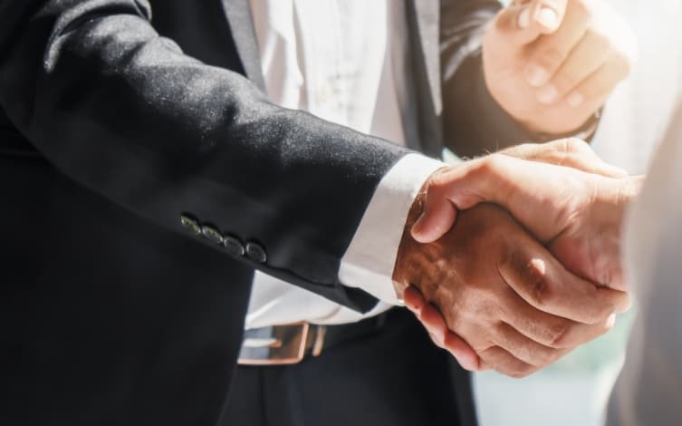 Close up of handshake | Bentley Systems | Infrastructure Engineering Software Company Close up of handshake