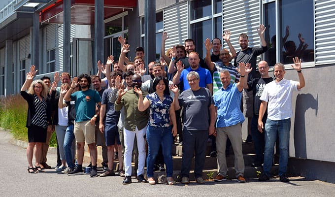 Group photo standing outside of front entrance from Quebec Bentley office