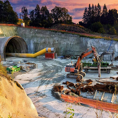 A construction site with machinery, including an excavator and equipment, near a large tunnel entrance. Trees and a colorful sky are in the background, while early adopters of OpenGround share user stories about the project's progress. | Bentley Systems | Infrastructure Engineering Software Company A construction site with machinery, including an excavator and equipment, near a large tunnel entrance. Trees and a colorful sky are in the background, while early adopters of OpenGround share user stories about the project's progress.