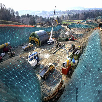 The construction site, featuring various heavy machinery such as excavators, trucks, and cranes in operation, is marked with a patterned overlay indicating possible planning or mapping activity by CMW Geosciences. | Bentley Systems | Infrastructure Engineering Software Company The construction site, featuring various heavy machinery such as excavators, trucks, and cranes in operation, is marked with a patterned overlay indicating possible planning or mapping activity by CMW Geosciences.