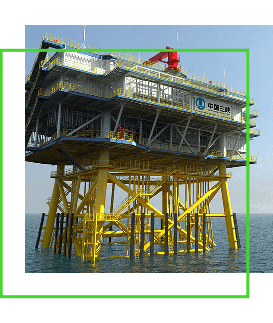 An oil rig in the ocean with a green frame. | Bentley Systems | Infrastructure Engineering Software Company An oil rig in the ocean with a green frame.