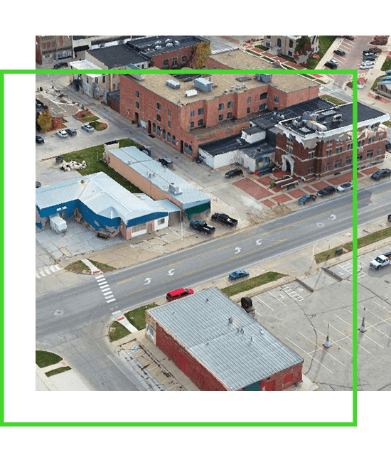 An aerial view of a street and buildings. | Bentley Systems | Infrastructure Engineering Software Company An aerial view of a street and buildings.
