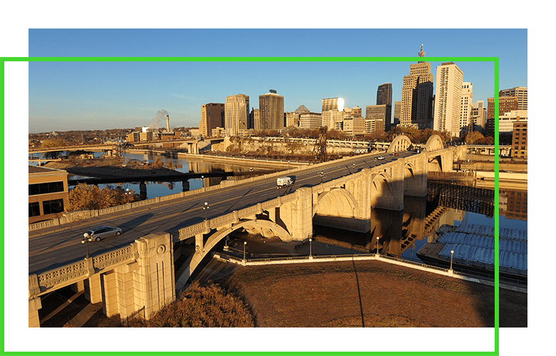 city skyline and bridge across river